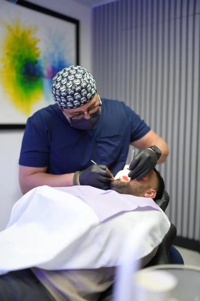 Dr. Juan Alvarado performing a dental implant procedure